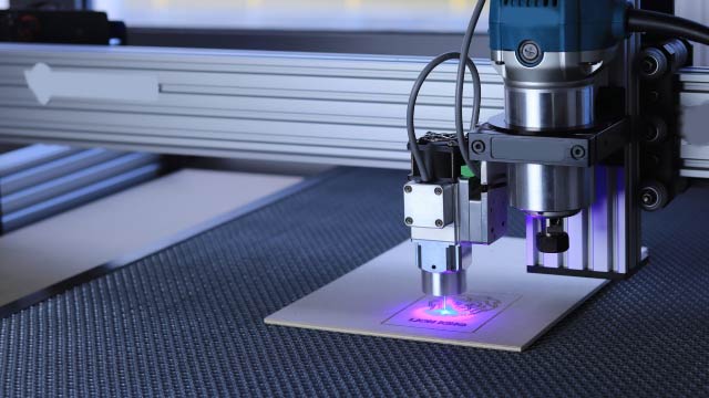 Fully automatic dual station laser merging and coding machine